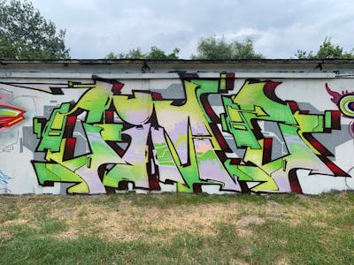 Grey and Light Green and Colorful Stylewriting by Cime. This Graffiti is located in Budapest, Hungary and was created in 2023.