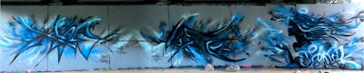 Light Blue and Black Stylewriting by Xhale and DEVOS. This Graffiti is located in Perth, Australia and was created in 2022. This Graffiti can be described as Stylewriting, Characters and Wall of Fame.
