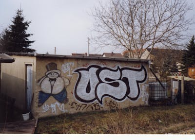 Chrome and Black Stylewriting by urine and OST. This Graffiti is located in Zschortau, Germany and was created in 2005. This Graffiti can be described as Stylewriting and Street Bombing.