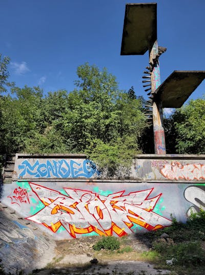 Chrome and Red and Orange Stylewriting by Riots. This Graffiti is located in Prague, Czech Republic and was created in 2023. This Graffiti can be described as Stylewriting, Atmosphere and Abandoned.