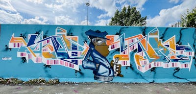 Light Blue and Orange Stylewriting by Vino AAA. This Graffiti is located in Essex, United Kingdom and was created in 2022. This Graffiti can be described as Stylewriting, Characters and Wall of Fame.