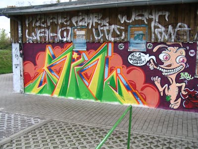 Colorful Wall of Fame by Pear, Horn and OST. This Graffiti is located in Delitzsch, Germany and was created in 2005. This Graffiti can be described as Wall of Fame, Stylewriting and Characters.