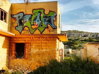 Light Blue and Light Green Stylewriting by Riots. This Graffiti is located in Malta and was created in 2011. This Graffiti can be described as Stylewriting and Abandoned.