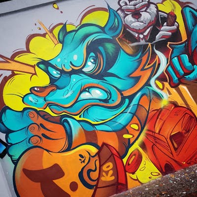 Cyan and Orange Characters by tempz. This Graffiti is located in Warsaw, Poland and was created in 2021.