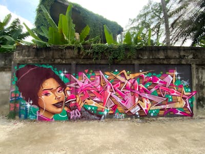 Coralle and Colorful Stylewriting by DEV and Eno_onf. This Graffiti is located in Jambi, Indonesia and was created in 2024. This Graffiti can be described as Stylewriting, Characters and Streetart.