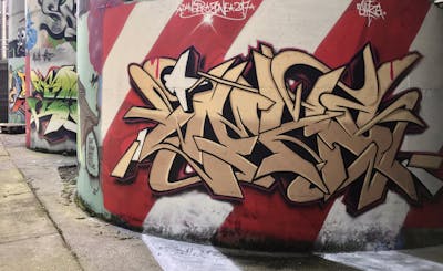 Beige and Brown Stylewriting by EmzG. This Graffiti is located in Zug, Switzerland and was created in 2022. This Graffiti can be described as Stylewriting and Wall of Fame.