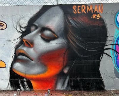 Grey and Orange and Red Characters by serman. This Graffiti is located in Kozani, Greece and was created in 2023.