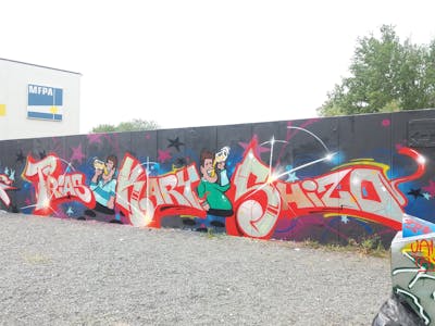 Red and Colorful Stylewriting by Trias, Kary and Shizo. This Graffiti is located in Germany and was created in 2023. This Graffiti can be described as Stylewriting, Characters and Wall of Fame.