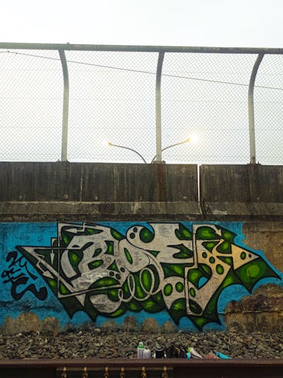 Chrome and Green and Light Blue Stylewriting by 12k.Boy. This Graffiti is located in Bogor, Indonesia and was created in 2023. This Graffiti can be described as Stylewriting and Line Bombing.