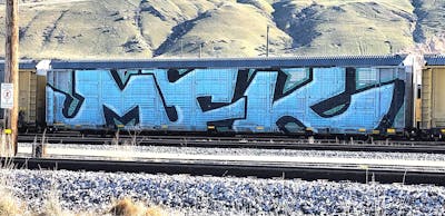 Light Blue Stylewriting by MFK. This Graffiti is located in United States and was created in 2024. This Graffiti can be described as Stylewriting, Trains, Wholecars and Freights.
