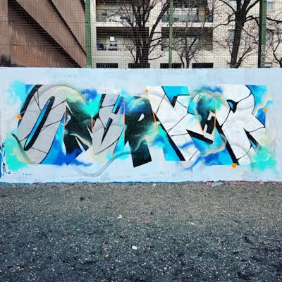 Light Blue and Grey Stylewriting by Omarker. This Graffiti is located in Lyon, France and was created in 2022. This Graffiti can be described as Stylewriting and Wall of Fame.