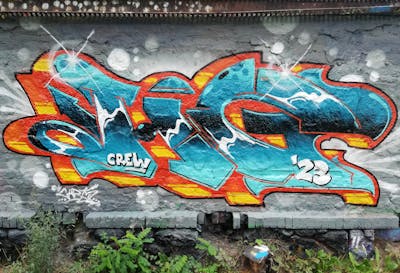 Cyan and Orange and Yellow Wall of Fame by Chr15, HG crew and HG. This Graffiti is located in Leipzig, Germany and was created in 2023. This Graffiti can be described as Wall of Fame and Stylewriting.