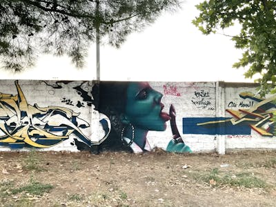 Cyan Characters by serman. This Graffiti is located in Ampelonas, Greece and was created in 2022. This Graffiti can be described as Characters and Stylewriting.