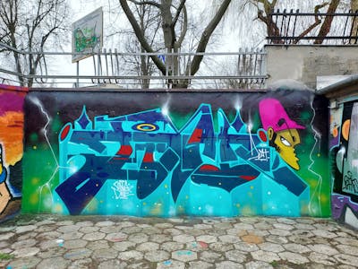 Cyan and Colorful Stylewriting by Fems173. This Graffiti is located in lublin, Poland and was created in 2023. This Graffiti can be described as Stylewriting and Characters.