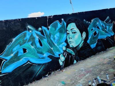 Cyan and Light Blue Characters by CUORE and SUMEK. This Graffiti is located in Berlin, Germany and was created in 2022. This Graffiti can be described as Characters, Stylewriting and Wall of Fame.