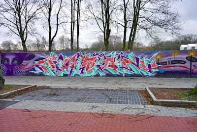 Cyan and Violet and Red Stylewriting by Jason one and Jason. This Graffiti is located in Lüneburg, Germany and was created in 2023. This Graffiti can be described as Stylewriting and Characters.