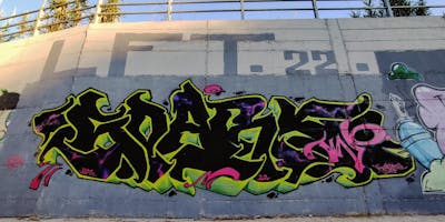 Black and Yellow and Coralle Stylewriting by SparkTwo and LFT. This Graffiti is located in Agrinio, Greece and was created in 2021. This Graffiti can be described as Stylewriting and Wall of Fame.