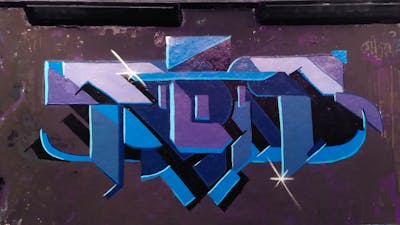 Blue and Light Blue and Violet Stylewriting by Tris. This Graffiti is located in Paris, France and was created in 2022. This Graffiti can be described as Stylewriting and Futuristic.