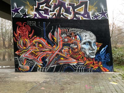 Red and Colorful and Grey Stylewriting by Oekounlogisch, Joker, Oeko and NFG. This Graffiti is located in Kiel, Germany and was created in 2024. This Graffiti can be described as Stylewriting, Characters, Streetart, Wall of Fame and 3D.