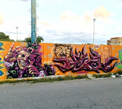 Violet and Orange Stylewriting by Jdhoner and dmcrew. This Graffiti is located in Maracay, Venezuela and was created in 2023. This Graffiti can be described as Stylewriting, Characters and 3D.