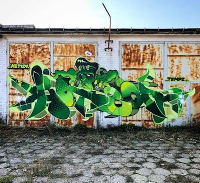 Green and Light Green Stylewriting by Ket124 and tempz. This Graffiti is located in Mysiadło, Poland and was created in 2019. This Graffiti can be described as Stylewriting, Characters and Abandoned.