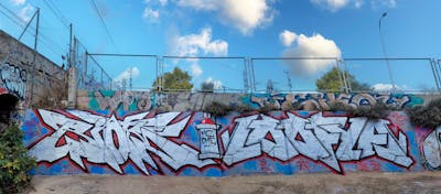 Chrome and Red and Light Blue Stylewriting by Riots and loofya. This Graffiti is located in Palma de Mallorca, Spain and was created in 2023. This Graffiti can be described as Stylewriting and Wall of Fame.