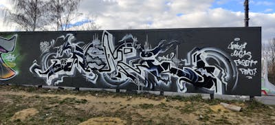 Black and White Stylewriting by Deki and AF Crew. This Graffiti is located in Wolfenbüttel, Germany and was created in 2022. This Graffiti can be described as Stylewriting and Wall of Fame.