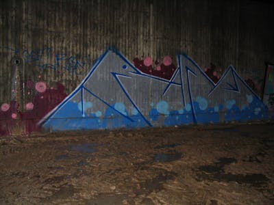 Chrome and Blue Street Bombing by urine and OST. This Graffiti is located in Bayreuth, Germany and was created in 2017. This Graffiti can be described as Street Bombing and Stylewriting.