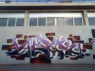 Violet and White Stylewriting by AMEK. This Graffiti is located in Alicante, Spain and was created in 2022.