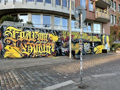 Yellow and Grey and Red Characters by spliff one and FEAR one. This Graffiti is located in Hamburg, Germany and was created in 2022. This Graffiti can be described as Characters and Stylewriting.